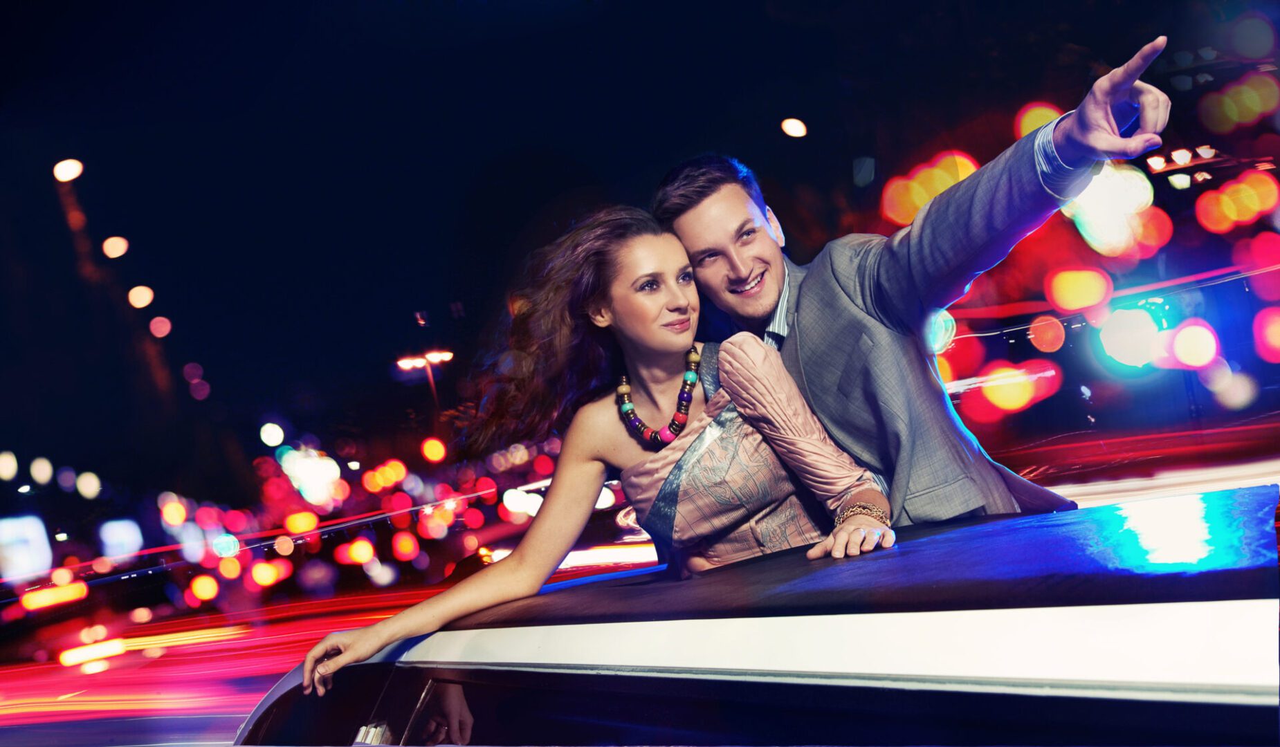 Couple enjoying a night out in a luxury limousine from cascade limos