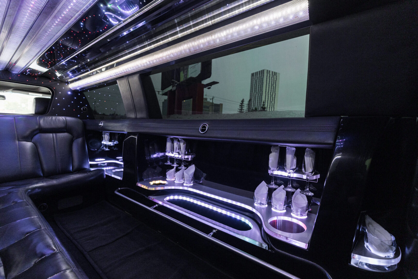 A black limo with a bar in the back.