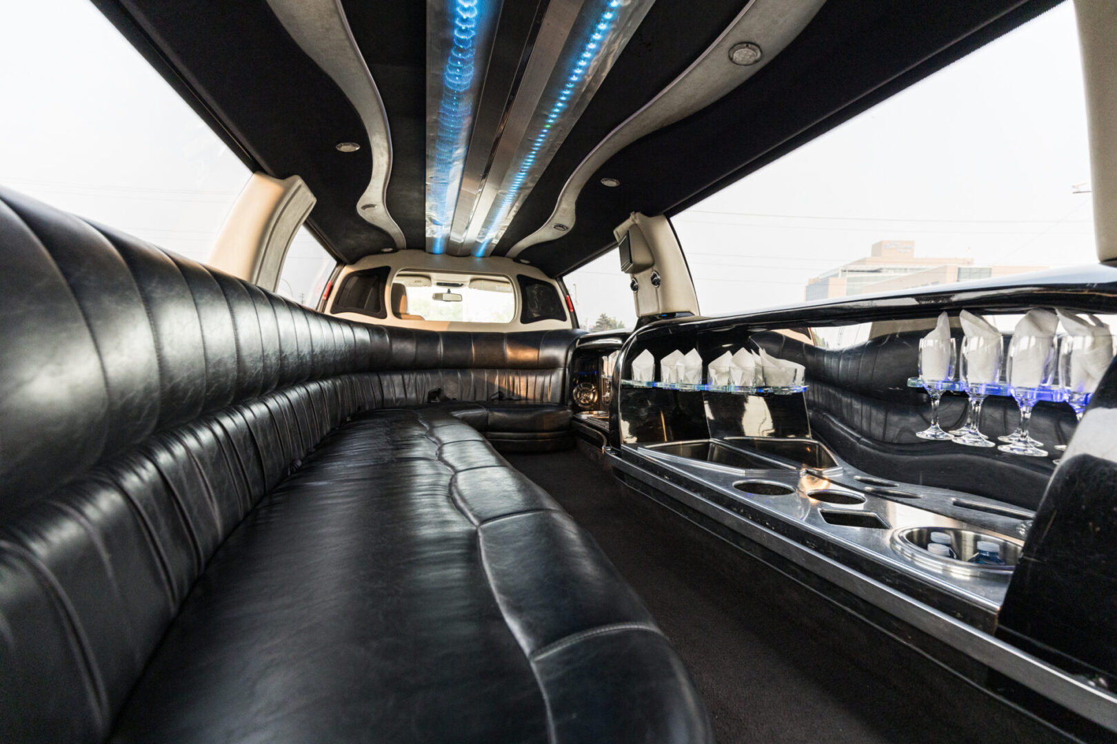 A black and white photo of an inside of a limo.