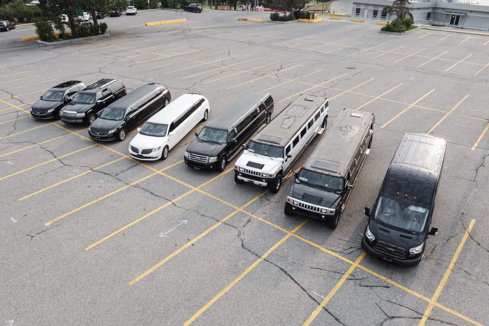 A parking lot with many vehicles parked in it
