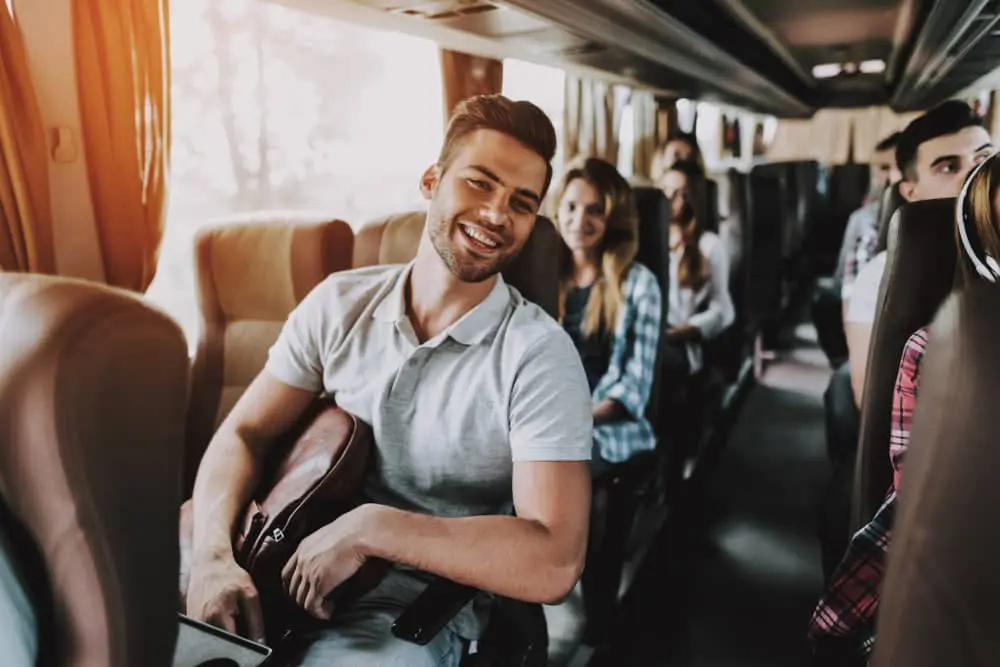 Happy passengers enjoying a city-to-city shuttle service