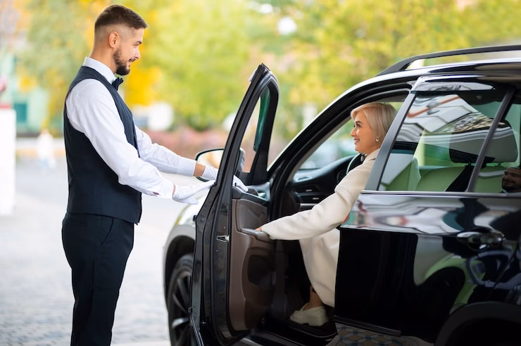 Valet helping woman with her limo